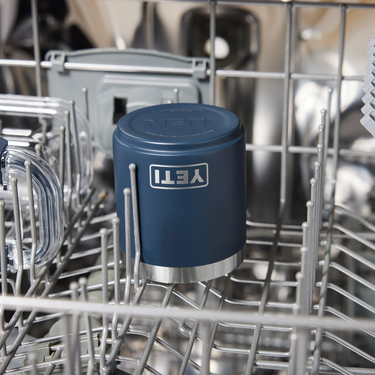 Blue YETI insulated lowball inside a dishwasher rack.